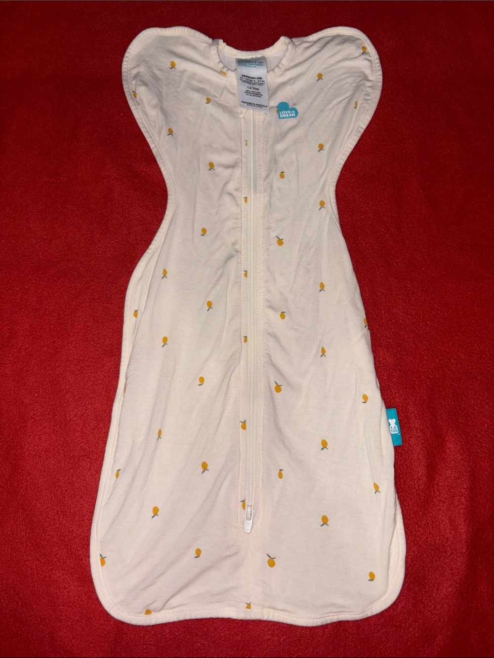 Love to Dream Cream Swaddle with Mustard Dot Accents